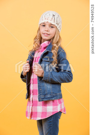 Girl model in jeans suit, hat, plaid shirt Girl model in jeans suit, hat, plaid shirt 74949528