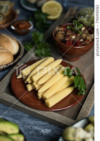 baby sweetcorn, escalivada and bread buns baby sweetcorn, escalivada and bread buns 74949892