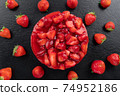 cheesecake with strawberry and fresh berries on black background 74952186