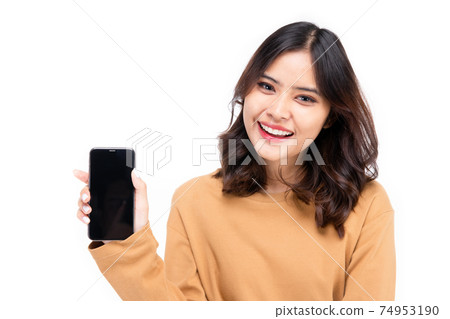 Portrait of Asian woman showing or presenting mobile phone application on hand isolated over white background, Portrait of Asian woman showing or presenting mobile phone application on hand isolated over white background, 74953190