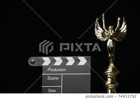 image of gold statue clapper board dark background image of gold statue clapper board dark background 74953792