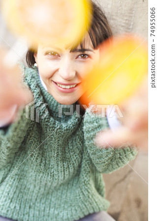 Portrait of pretty young happy woman posing with sweet lollipops. 74955066