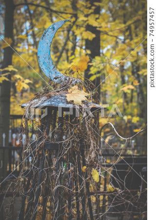 Old islamic cemetery, funeral and burial of muslim. A grave with iron crescent moon. Metal gravestone 74957457