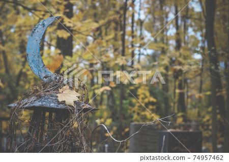 religious symbol of Islam iron steel crescent moon near the grave in the cemetery 74957462