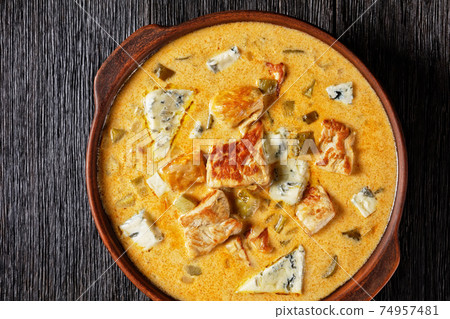 Pork stew with pickles, and blue mold cheese Pork stew with pickles, and blue mold cheese 74957481