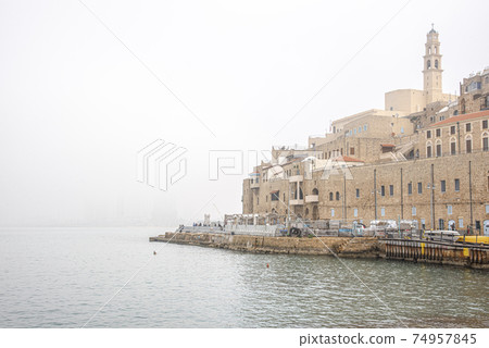 Old Jaffa Port and Tel-Aviv In fog time 74957845