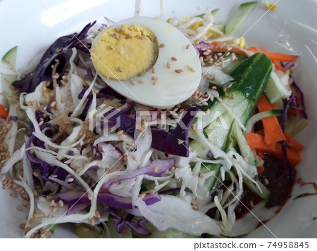Jjolmyeon filled with fresh vegetables 74958845