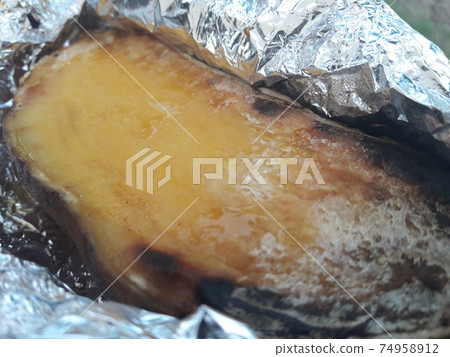 Roasted sweet potatoes wrapped in foil Roasted sweet potatoes wrapped in foil 74958912