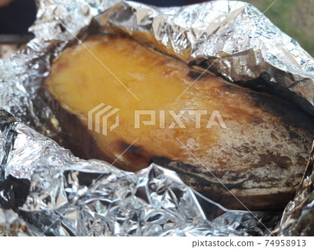 Roasted sweet potatoes wrapped in foil Roasted sweet potatoes wrapped in foil 74958913