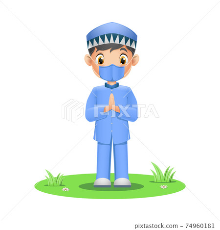Cute Muslim boy wearing face mask on grass 74960181