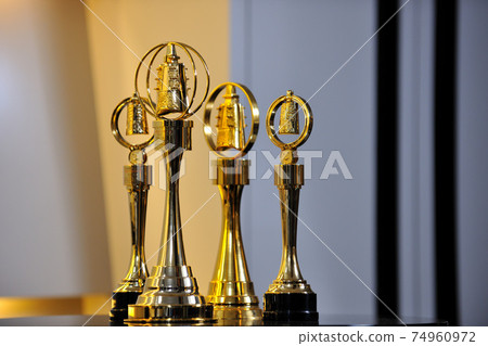Awards, trophies, golden bells, ringing the bell, winning, rewards 74960972