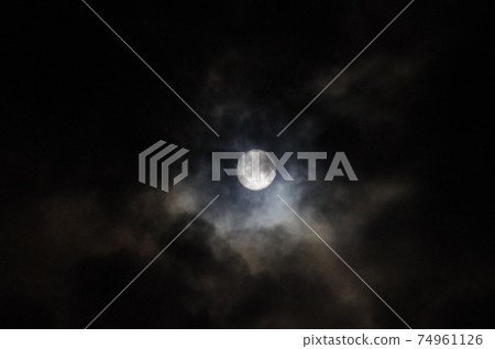 Moon over the clouds 74961126