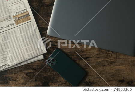 Business image at home (PC, smartphone, newspaper) 74963360