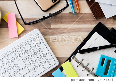 Office supplies bird's-eye view wood grain background shooting material 74964381