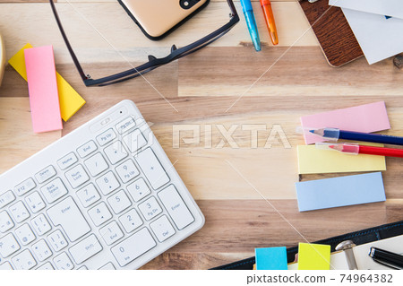 Office supplies bird's-eye view wood grain background shooting material 74964382