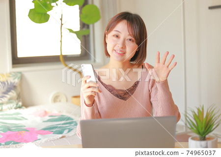 A woman calling for a smartphone 74965037