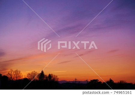 The contrast between the sunset sky, the distant mountains and the shadows of the trees The contrast between the sunset sky, the distant mountains and the shadows of the trees 74965161