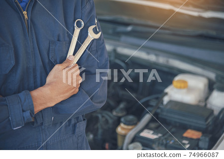 Mechanic car service auto garage in automotive mobile center. Technician workshop repair engine 74966087
