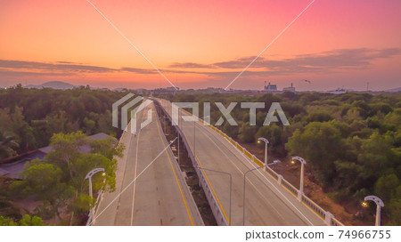 The sun rises over Thepsrisin Bridge. Thepsrisin Bridge is a shortcut to connect the city from Saphan Hin intersection with Sakdidet intersection in order to reduce the bad traffic congestion. The sun rises over Thepsrisin Bridge. Thepsrisin Bridge is a shortcut to connect the city from Saphan Hin intersection with Sakdidet intersection in order to reduce the bad traffic congestion. 74966755