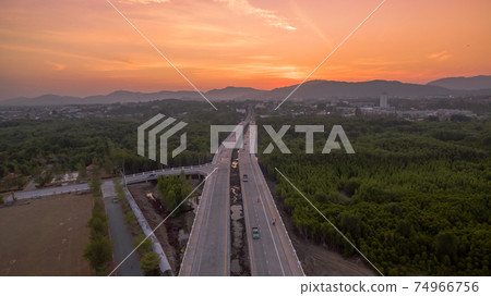 The sun rises over Thepsrisin Bridge. Thepsrisin Bridge is a shortcut to connect the city from Saphan Hin intersection with Sakdidet intersection in order to reduce the bad traffic congestion. The sun rises over Thepsrisin Bridge. Thepsrisin Bridge is a shortcut to connect the city from Saphan Hin intersection with Sakdidet intersection in order to reduce the bad traffic congestion. 74966756
