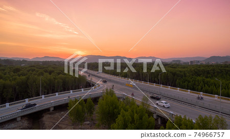 The sun rises over Thepsrisin Bridge. Thepsrisin Bridge is a shortcut to connect the city from Saphan Hin intersection with Sakdidet intersection in order to reduce the bad traffic congestion. 74966757