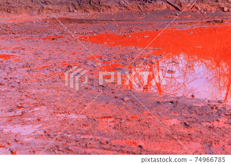 Close-up of red water polluted with iron ore waste 74966785