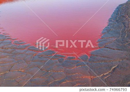Close-up of red water polluted with iron ore waste 74966793