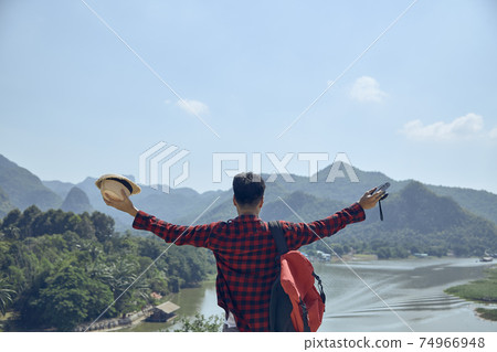 men look out over the mountains and rivers 74966948