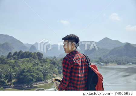 men look out over the mountains and rivers 74966953