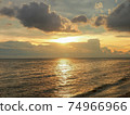 Evening atmosphere at Wonnapa Beach The golden light of the sun glitters on the sea. 74966966