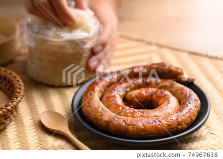 Northern Thai sausage (Sai Aua), Grilled intestine stuffed with minced pork, spices and herbs Northern Thai sausage (Sai Aua), Grilled intestine stuffed with minced pork, spices and herbs 74967638
