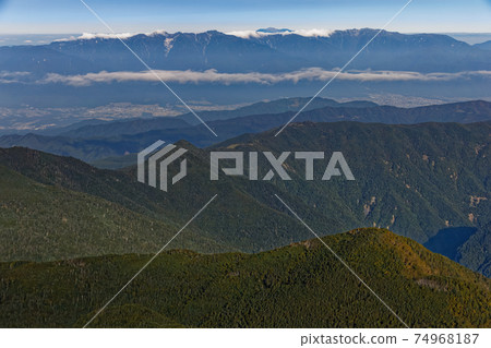 Morning Central Alps and Mt. Shiomi seen from the Southern Alps and Mt. Shiomi Morning Central Alps and Mt. Shiomi seen from the Southern Alps and Mt. Shiomi 74968187