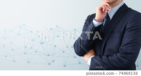 An image of thinking about technology and network systems. Network structure with men in blue suits. 74969138