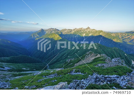 Yarigatake and Hotaka mountain range bathing in the morning sun from the summit of Mt. Otensho 74969710