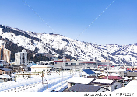 Yuzawa Town on a sunny day in winter Cityscape around Echigo Yuzawa Station Yuzawa Town on a sunny day in winter Cityscape around Echigo Yuzawa Station 74971237