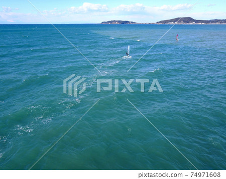 Windsurfing off the coast of Tateyama Windsurfing off the coast of Tateyama 74971608