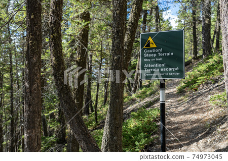 Stay on trail sign signpost at Tunnel Mountain Trail. Banff National Park, Canadian Rockies. Stay on trail sign signpost at Tunnel Mountain Trail. Banff National Park, Canadian Rockies. 74973045