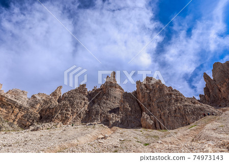Peaks of the Dolomites against the backdrop of a beautiful blue sky. South Tyrol, Italy Peaks of the Dolomites against the backdrop of a beautiful blue sky. South Tyrol, Italy 74973143