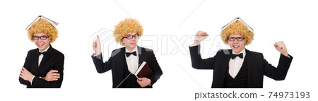 Young man wearing afro wig Young man wearing afro wig 74973193