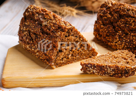 Closeup on sliced flourless diet grain bread Closeup on sliced flourless diet grain bread 74973821