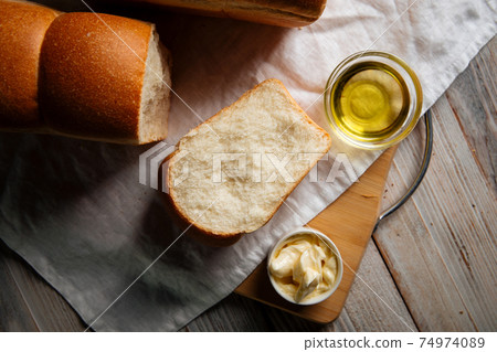Loafs of fresh baked shaped wheat bread Loafs of fresh baked shaped wheat bread 74974089