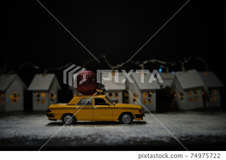 toy car on the background of houses toy car on the background of houses 74975722