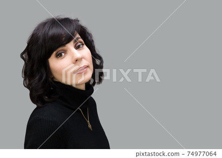 Adult beautiful brunette woman on gray background. Adult beautiful brunette woman on gray background. 74977064