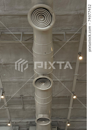 Big pipeline of air condition duct in factory theme decoration empty factory. 74977452