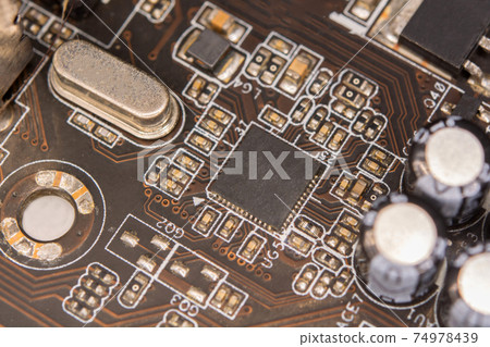 Close up blank microchip on Electronic circuit board. 74978439