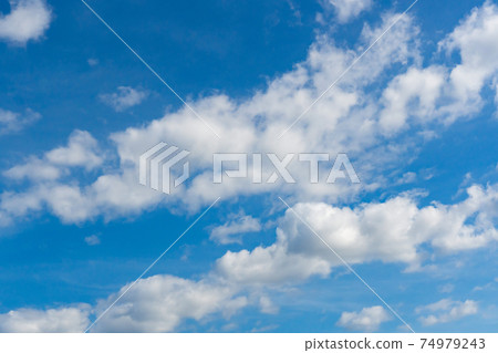 Cirrus and cumulus clouds on blue sky background. 74979243
