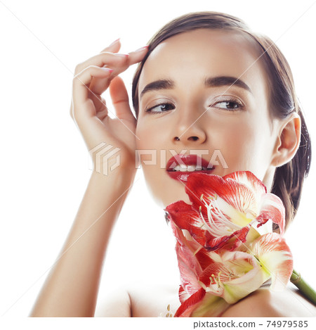 young pretty brunette real woman with red flower amaryllis close up isolated on white background. Fancy fashion makeup, bright lipstick, creative Ombre manicured nails young pretty brunette real woman with red flower amaryllis close up isolated on white background. Fancy fashion makeup, bright lipstick, creative Ombre manicured nails 74979585