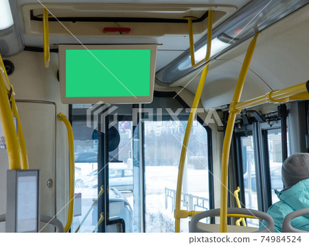 information board in the bus cabin. advertising in public transport. screen on the bus, a place for advertising 74984524