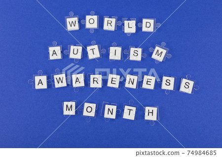 Transparent jigsaw puzzle details on inscription on blue background. 74984685