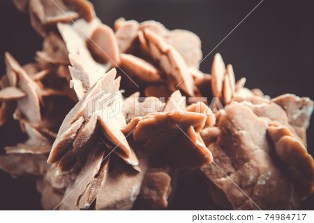 Desert rose crystal isolated on black background Desert rose crystal isolated on black background 74984717